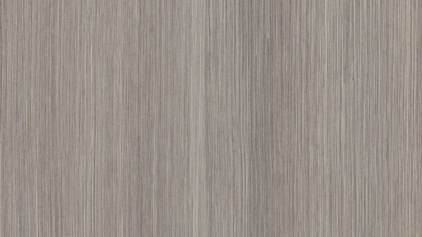 Close-up of brown walnut wood texture, chocolate-brown background.
