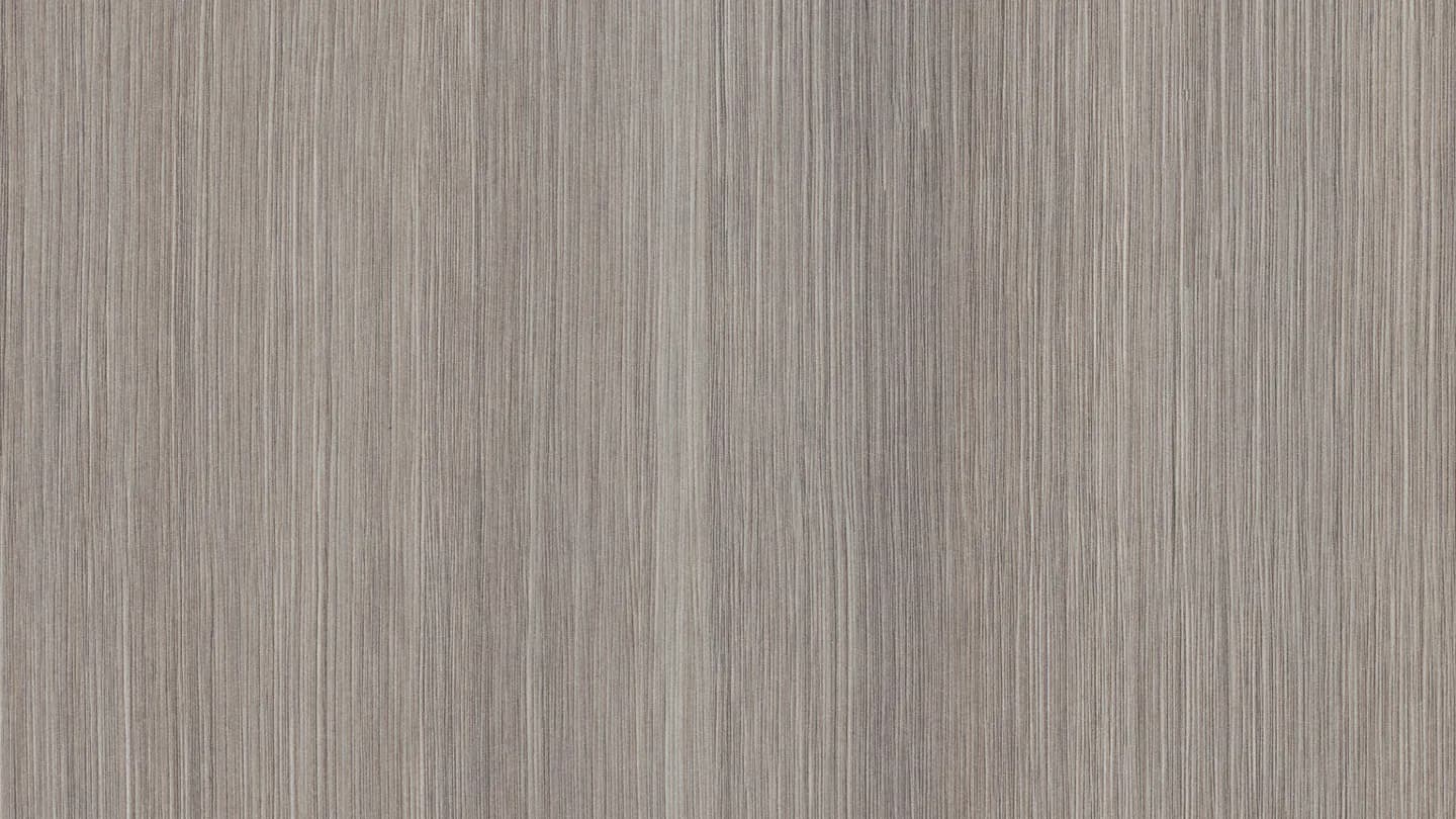 Close-up of brown walnut wood texture, chocolate-brown background.